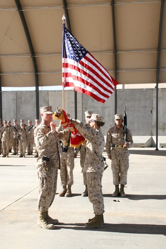 Lieutenant Col. Maura M. Hennigan, right, commanding officer, Marine Wing Support Squadron 372, and GySgt. Russell J. Hufsey, senior enlisted advisor, MWSS-372, case the unit's battle colors during a transfer of authority ceremony held aboard Camp Bastion, Afghanistan, April 7, 2014. Marine Wing Support Squadron 372 was replaced by MWSS-274, which took on the responsibility of providing ground support for the aviation combat element with Regional Command (Southwest).