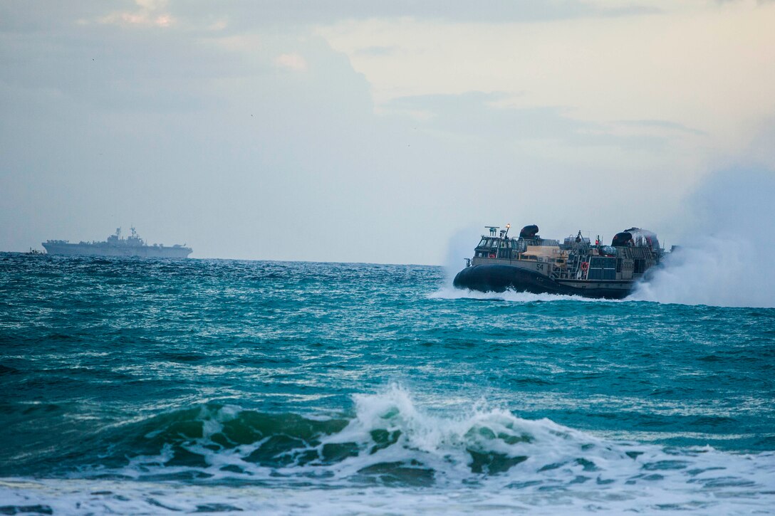 A U.S. Navy landing craft, air cushion with Assault Craft Unit 4 prepares to land on the beach at Sierra del Retín, Spain, to unload U.S. Marines and equipment during Spanish Amphibious Bilateral Exercise (PHIBLEX) 2014 Feb. 24, 2014. Spanish PHIBLEX is an annual exercise designed to improve interoperability, increase readiness and develop professional and personal relationships between U.S. forces and participating nations. The 22nd Marine Expeditionary Unit is deployed to the U.S. 6th Fleet area of responsibility with the Bataan Amphibious Ready Group as a sea-based, expeditionary crisis response force capable of conducting amphibious missions across the full range of military operations.