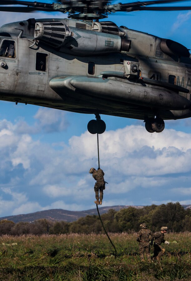 A U.S. Marine with Battalion Landing Team 1st Battalion, 6th Marine Regiment, 22nd Marine Expeditionary Unit (MEU), fast ropes from a CH-53E Super Stallion helicopter with Marine Medium Tiltrotor Squadron (VMM) 263 (Reinforced), 22nd MEU, at a training range in Sierra del Retín, Spain, during Spanish Amphibious Bilateral Exercise (PHIBLEX) 2014 Feb. 24, 2014. Spanish PHIBLEX is an annual exercise designed to improve interoperability, increase readiness and develop professional and personal relationships between U.S. forces and participating nations. The MEU is deployed to the U.S. 6th Fleet area of responsibility with the Bataan Amphibious Ready Group as a sea-based, expeditionary crisis response force capable of conducting amphibious missions across the full range of military operations.