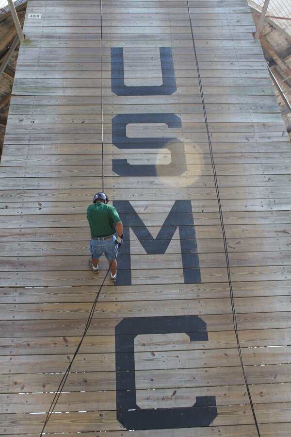 William Joiner, the athletic director of New Haven High School in Southfield, Mich., rappels down the rappel tower during Recruiting Station Detroit’s Educator Workshop at Marine Corps Recruit Depot Parris Island, S.C. April 3, 2014. The Educator Workshop is an annual program conducted by recruiting stations across the United States with the goal of enhancing educator’s knowledge about the Marine Corps for when they advise their students about possible career paths. (U.S. Marine Corps photo by Cpl. Nicholas S. Ranum/Released)