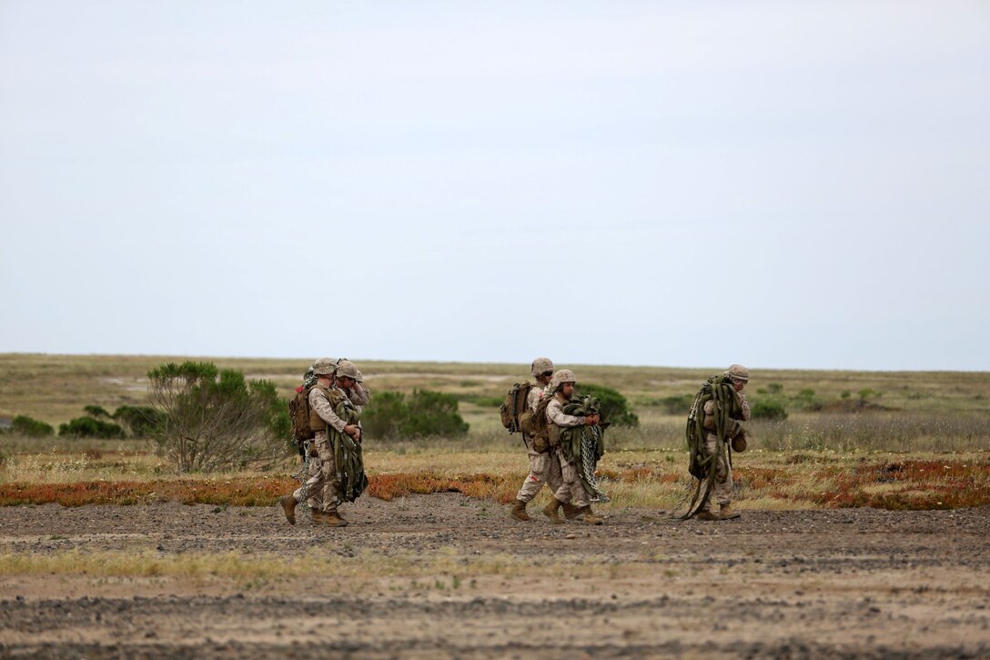 Marines and sailors with Combat Logistics Battalion 11, 11th Marine Expeditionary Unit prepare for a helicopter support team mission as part of Amphibious Squadron Marine Expeditionary Unit Integration Training (PMINT) on San Clemente Island, Calif., April 10, 2014.  PMINT is a two-week predeployment training event focused on the combined capabilities of the 11th MEU and Makin Island Amphibious Ready Group, conducting amphibious operations, crisis response, and limited contingency operations.  (U.S. Marine Corps photo by Lance Cpl. Evan R. White/Released)