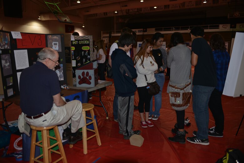 Tom Strother, a teacher at the Knox Doss steers a remote control vehicle between students to show those attending the  Science, Technology, Engineering and Mathematics Expo how it works.  The Expo was sponsored by the Middle Tennessee STEM Innovation Hub at the Volunteer State Community College in Gallatin on April 11, 2014.  