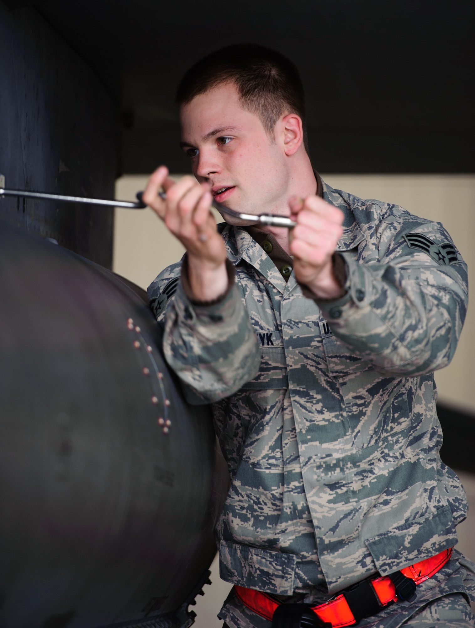 Senior Airman Trenton Metyk, 35th Aircraft Maintenance Unit load crew member, readies an F-16 Fighting Falcon during the 1st Quarter Load Crew Competition at Kunsan Air Base, Republic of Korea, Apr. 11, 2014. The 8th Maintenance Group weapons standardization team hosted the competition to showcase the skills and abilities of each AMU squadron as well as to promote espirit de corps. (U.S. Air Force photo by Senior Airman Armando A. Schwier-Morales/Released)