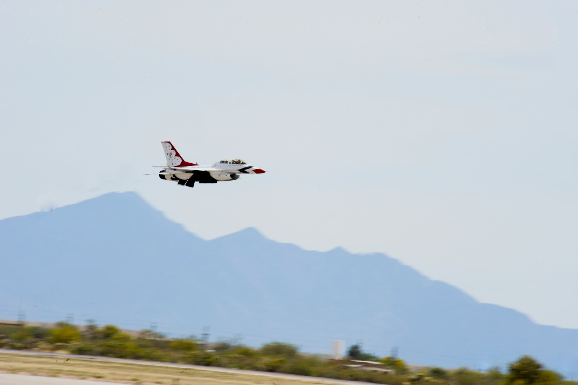 A U.S. Air Force Thunderbird takes off during a Hometown Hero Flight for Jeannette Mare, founder and executive director of Ben’s Bells Project, at Davis-Monthan Air Force Base, Ariz., April 11, 2014. During preparation for the flight, Mare said she was honored and humbled for being selected to fly with the Thunderbirds. (U.S. Air Force photo by Senior Airman Sivan Veazie/Released)