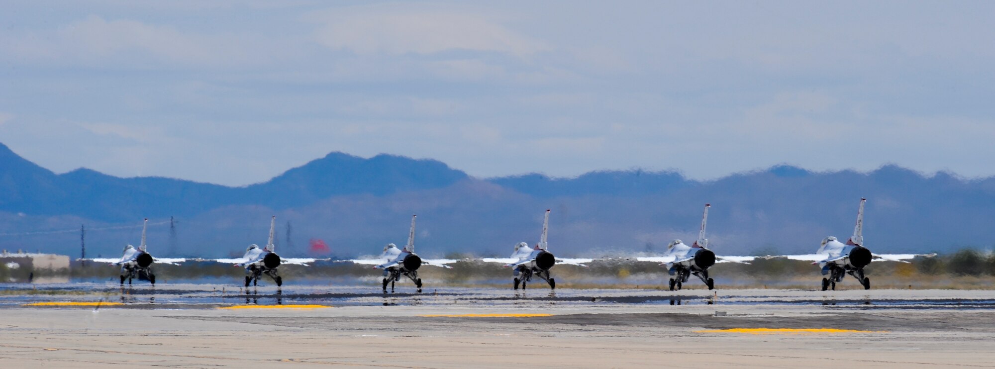 U.S. Air Force Thunderbirds Air Demonstration Squadron taxis to the runway with Jeannette Mare, founder and executive director of Ben’s Bells Project, during her Hometown Hero Flight at Davis-Monthan Air Force Base, Ariz., April 11, 2014. The project’s mission is to inspire, educate and motivate each other to realize the impact of intentional kindness and to empower individuals to act accordingly. (U.S. Air Force photo by Senior Airman Sivan Veazie/Released)