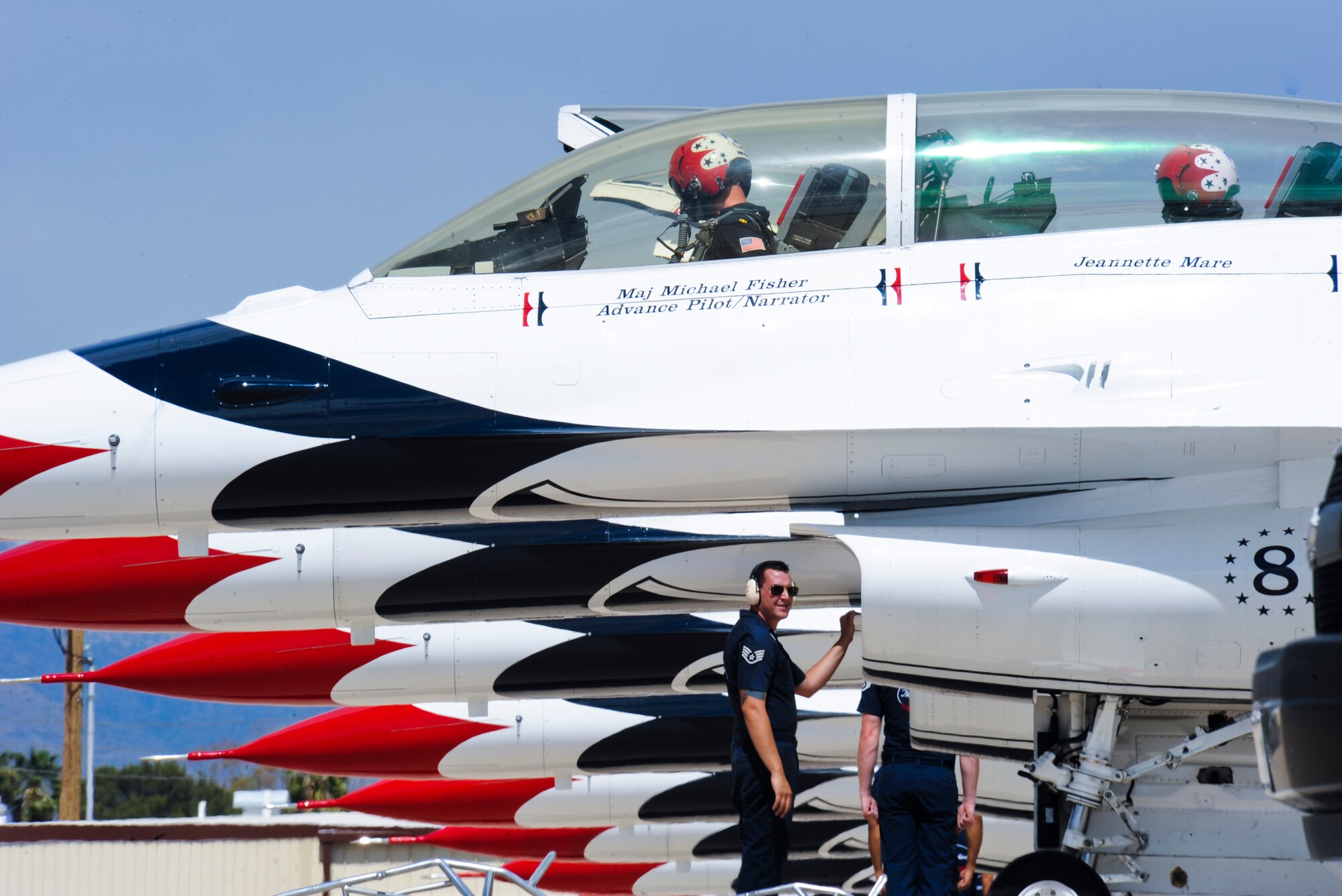U.S. Air Force Maj. Michael Fisher, U.S. Air Force Thunderbird Air Demonstration Squadron pilot, goes through his flight checklist with Jeannette Mare, founder and executive director of Ben’s Bells Project, during her Hometown Hero Flight at Davis-Monthan Air Force Base, Ariz., April 11, 2014. The “Ambassadors in Blue” have been performing aerial demonstrations for more than 60 years. (U.S. Air Force photo by Senior Airman Sivan Veazie/Released)