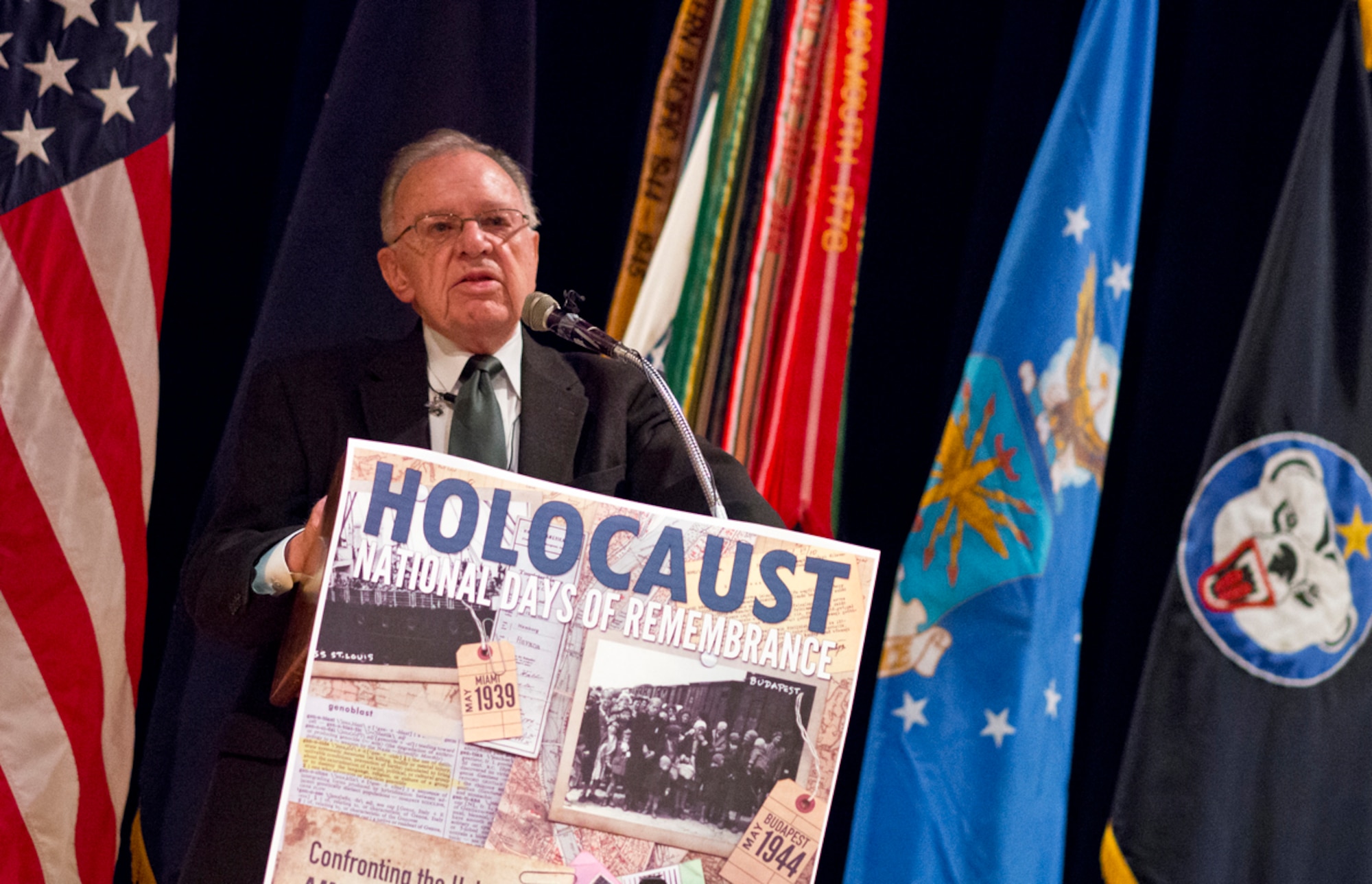 World War II veteran Alvin H. Fleetwood speaks to Soldiers and Airmen, Thursday, April 10, 2014, at the Frontier Theater on Joint Base Elmendorf-Richardson, Alaska, about his experiences helping to liberate Camp Dachau, a concentration camp, on April 29, 1945, in honor of the Holocaust National Days of Rememberance. Fleetwood was serving as a front line medic in the U.S. Army's 71st Infantry Division when his unit assisted in the liberation of the camp. (U.S. Air Force photo/Justin Connaher)