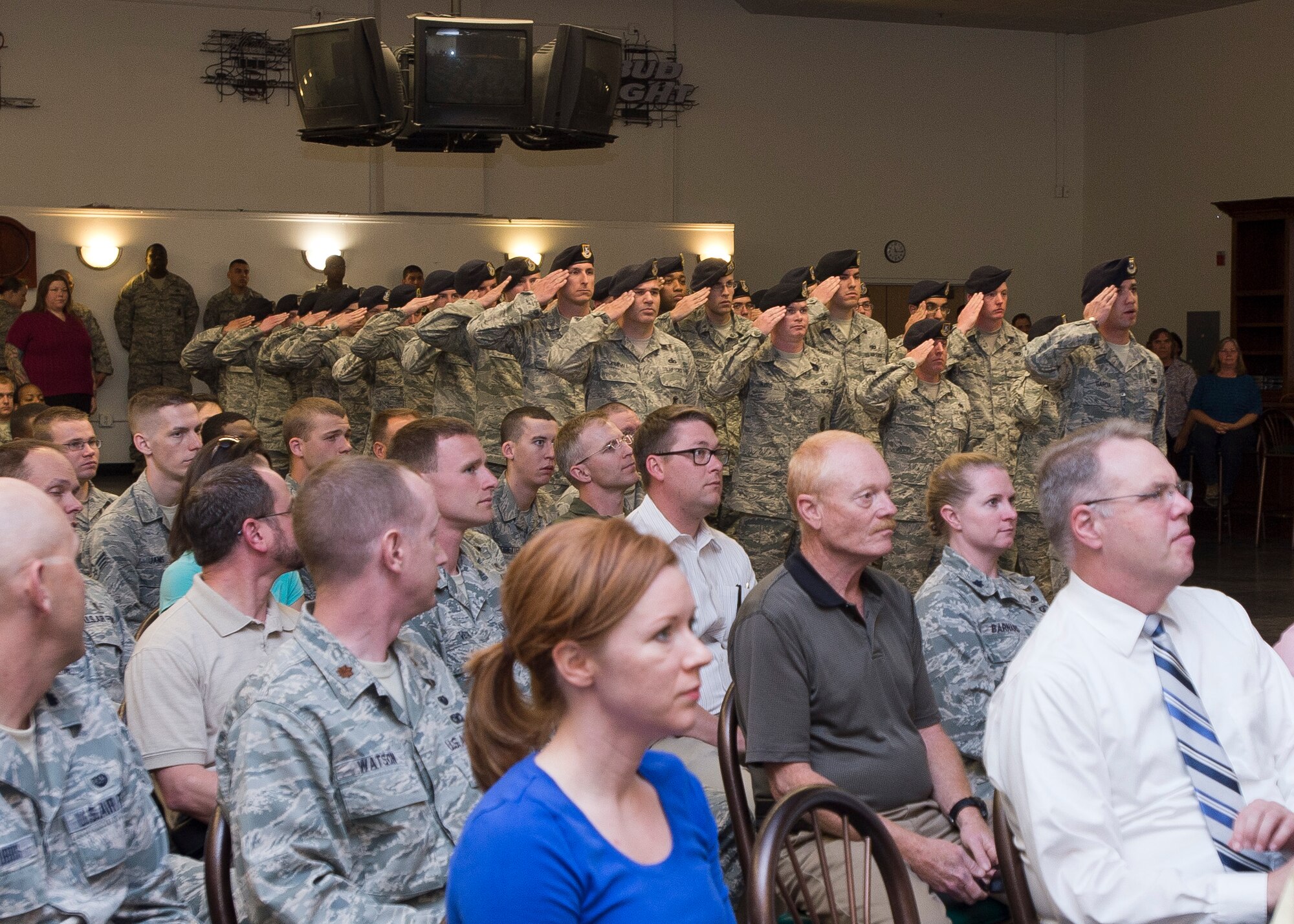 In the background, members of the 412th Security Forces Squadron salute their new commander, Lt. Col. Leonard Rose. The assumption of command ceremony was held at the Oasis Community Center. (U.S. Air Force photo by Ethan Wagner)