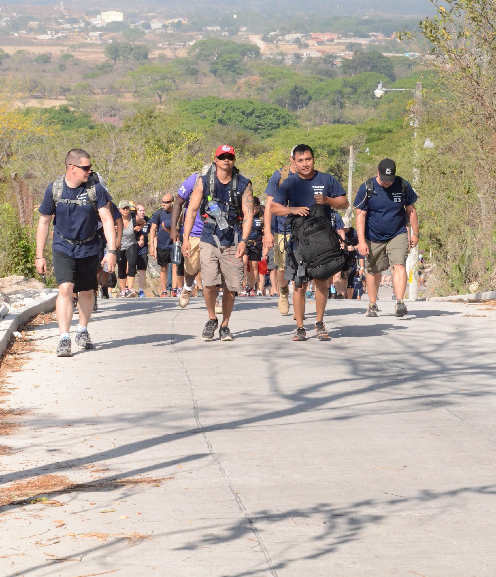 More than 130 members of Joint Task Force-Bravo completed a 6.2 mile round trip hike to deliver more than 3,000 pounds of food and supplies to families in need in the mountain village, April 12, 2014. During the more than three mile trek up the mountain, Task Force members made an elevation gain of 1,600 feet while carrying more than 25 pounds of supplies each. The food and supplies were all purchased with donations made by the members of Joint Task Force-Bravo. (Photo by U. S. Air Force Technical Sgt. Breihan Fetz)