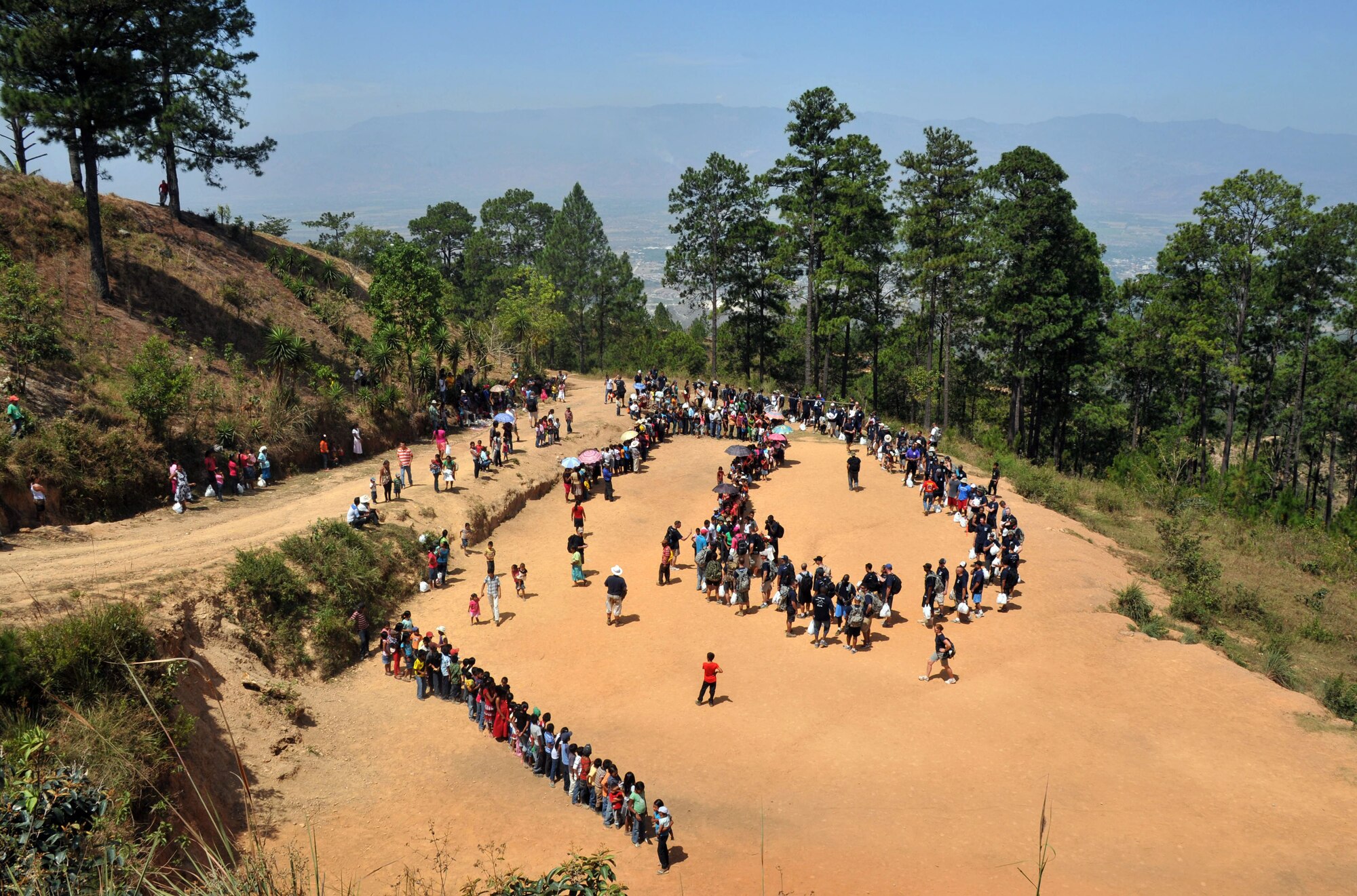 More than 130 members of Joint Task Force-Bravo completed a 6.2 mile round trip hike to deliver more than 3,000 pounds of food and supplies to families in need in the mountain village, April 12, 2014. During the more than three mile trek up the mountain, Task Force members made an elevation gain of 1,600 feet while carrying more than 25 pounds of supplies each. The food and supplies were all purchased with donations made by the members of Joint Task Force-Bravo. (Photo by Ana Fonseca)