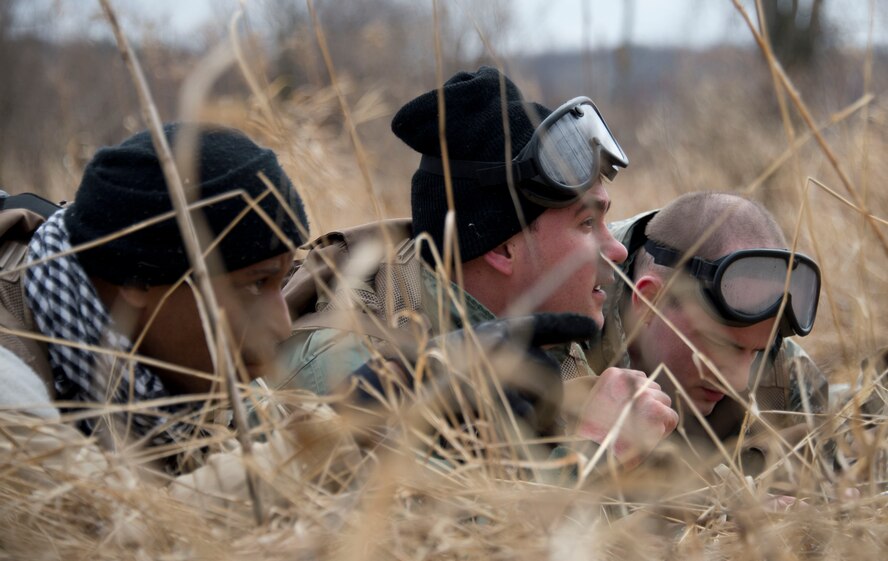 Airmen from the 109th Airlift Squadron and 109th Aeromedical Evacuation Squadron survey the land for the best route in Arden Hills, Minn., Apr. 12, 2014. The Airmen are going through a refresher Survival, Evasion, Resistance and Escape training exercise to maintain their proficiency with the techniques and skills that will keep them alive.
(U.S. Air National Guard photo by Tech. Sgt. Amy M. Lovgren/ Released)
