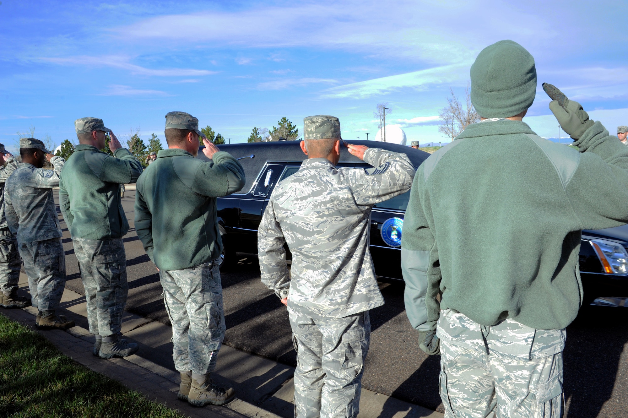 Team Buckley members lined the streets for the final procession of Senior Airman Michael S. Snyder, 460th Space Communications Squadron cyber transport journeyman, April 15, 2014, at Buckley Air Force Base, Colo. Snyder, an El Paso, Ill. native, was 23 years old and had been at Buckley for two years before he was killed by an alleged drunk driver while on his motorcycle the night of April 9, 2014. (U.S. Air Force photo by Airman Emily E. Amyotte/Released)
