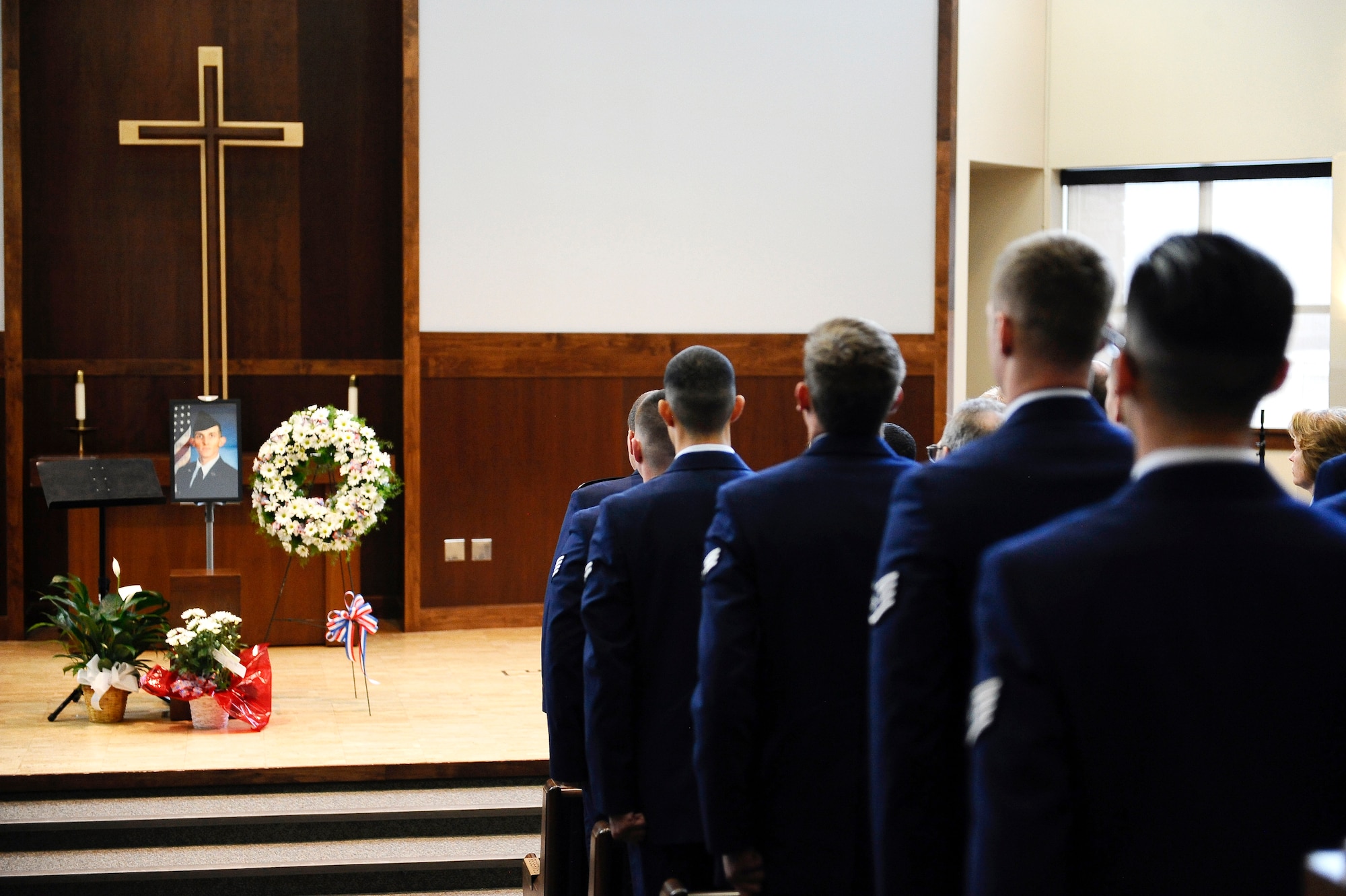 Team Buckley members attended the memorial service for Senior Airman Michael S. Snyder, 460th Space Communications Squadron cyber transport journeyman, April 14, 2014, at the base chapel on Buckley Air Force Base, Colo. Snyder, an El Paso, Ill. native, was 23 years old and had been at Buckley for two years before he was killed by an alleged drunk driver while on his motorcycle the night of April 9, 2014. (U.S. Air Force photo by Airman 1st Class Samantha Saulsbury/Released)