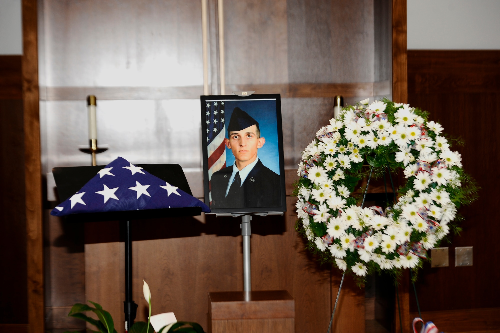 Team Buckley members attended the memorial service for Senior Airman Michael S. Snyder, 460th Space Communications Squadron cyber transport journeyman, April 14, 2014, at the base chapel on Buckley Air Force Base, Colo. Snyder, an El Paso, Ill. native, was 23 years old and had been at Buckley for two years before he was killed by an alleged drunk driver while on his motorcycle the night of April 9, 2014. (U.S. Air Force photo by Airman 1st Class Samantha Saulsbury/Released)