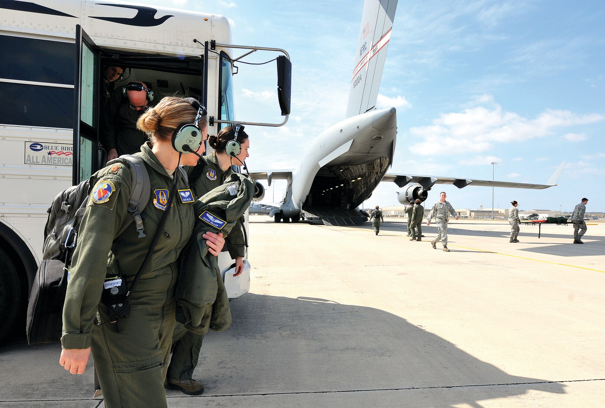 WRIGHT-PATTERSON AIR FORCE BASE, Ohio - Maj. Kathy Miller, Senior Airman Racheal Wilson and fellow Airmen of the 445th Aeromedical Evacuation Squadron prepare to board a C-17 Globemaster III aircraft. The reservists participated in a three-day training mission on a 445th Airlift Wing C-17 from Wright-Patterson AFB, Ohio, to Florida and Texas and back, Feb 21 – 23, 2014. (U.S. Air Force photo/Tech. Sgt. Frank Oliver)