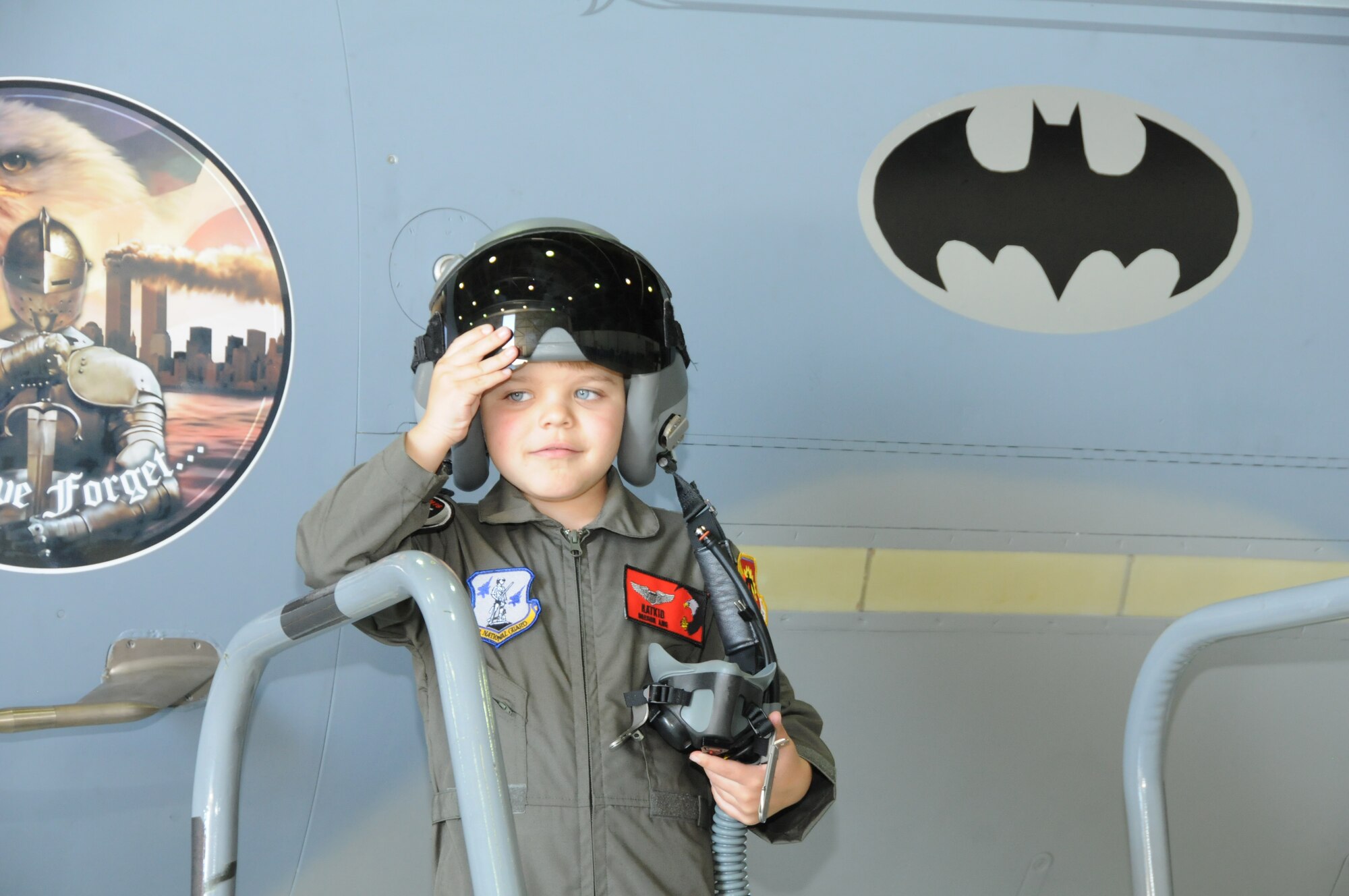 Miles Scott, call sign,“Batkid”, reported for duty at the 173rd Fighter Wing in Klamath Falls, Ore., April 10, 2014. Scott is in remission from leukemia and had the opportunity to be a part of the Fighter Pilot for a Day program hosted by the 114th Fighter Squadron. The jet bears a batman symbol which crew chief Tech. Sgt. Cliff Rutledge had affixed to the jet in honor of Scott’s visit. Scott has battled leukemia and his doctors have recently said he is in remission. (U.S. Air Force photo by Tech. Sgt. Jefferson Thompson/released)