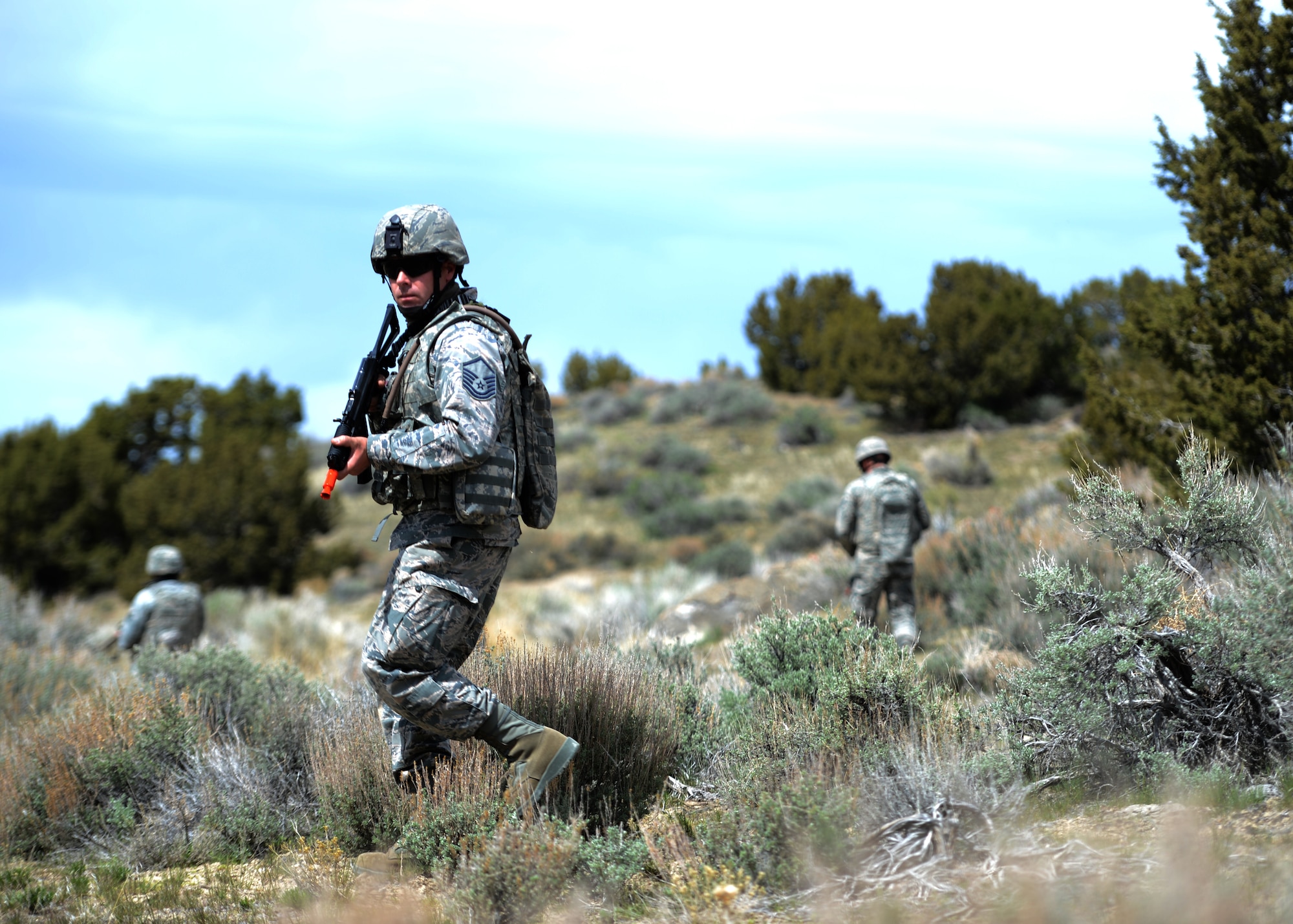 Master Sgt. Robert Jensen, 419th Security Forces Squadron, keeps a watchful eye while providing security for two “downed” F-16 pilots during the Lone Survivor exercise in Utah’s west desert April 12. The training scenario was a joint endeavor between Utah’s Reserve Components, including the Air Force Reserve, Utah Air National Guard, and Utah Army National Guard. (U.S. Air Force photo/Senior Airman Justyn M. Freeman)