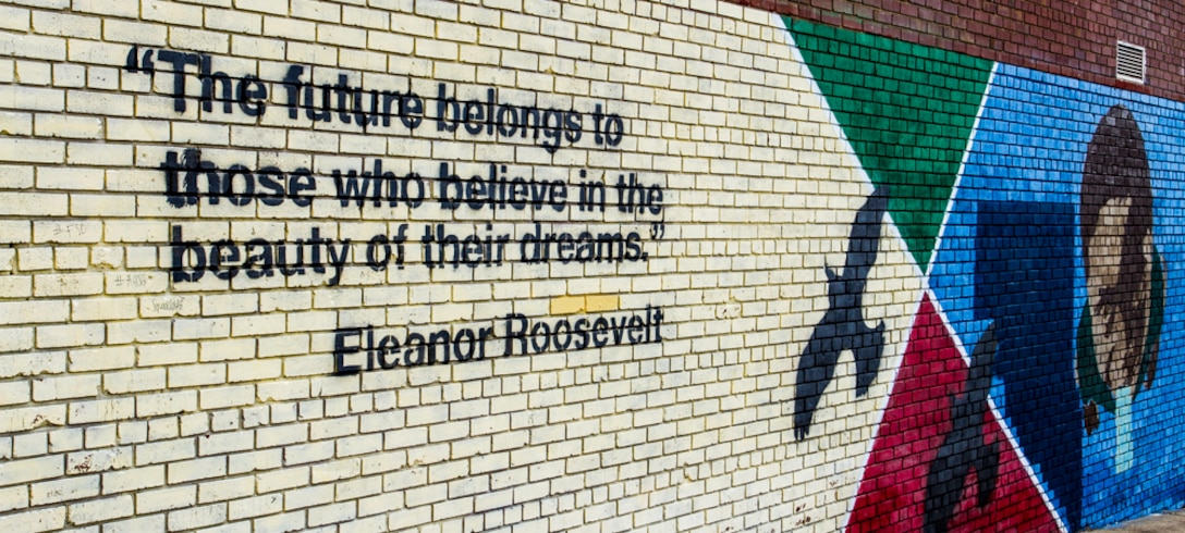 This quote from Eleanor Roosevelt on the wall of Charles Hart Middle School figured into Master Sgt. Ryan Carson’s positive message to the school’s student body about following their dreams before the U.S. Air Force Band’s rock ensemble Max Impact finished of their March 26 performance at the school with Journey’s “Don’t Stop Believing.” (U.S. Navy photo by Lt. Cmdr. Jim Remington)