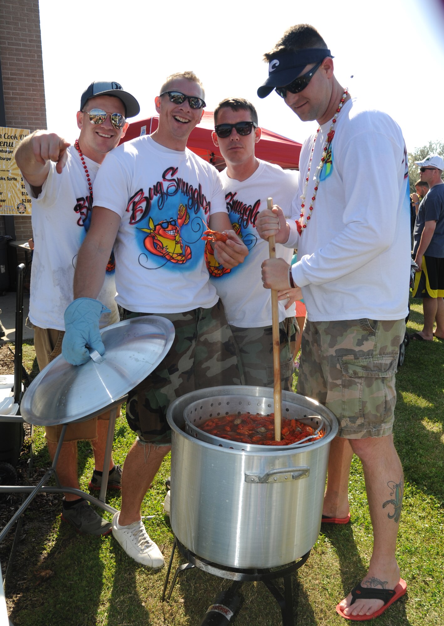 The reigning champion team, “Bug Smugglers”, stir a fresh batch of boiled crawfish with the ‘fixins’ during the 2nd Annual Bay Breeze Crawfish Cook-Off April 11, 2014, at the Bay Breeze Event Center, Keesler Air Force Base, Miss. The trophy was taken by the “Cajun Snappa” team, who will receive a free entry into the 22nd Annual Mississippi Coast Coliseum Crawfish Festival Cook-Off.  (U.S. Air Force photo by Kemberly Groue)
