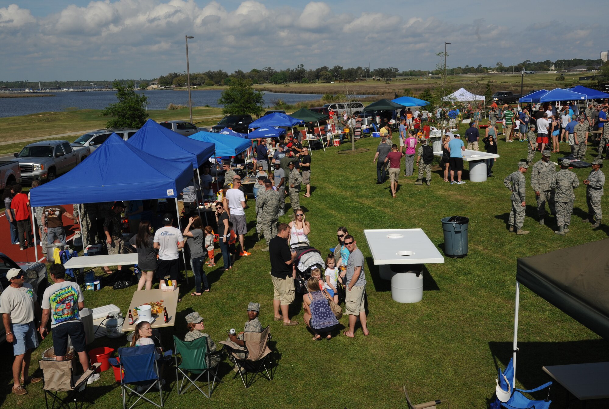Competitors and spectators gather on the lawn of the Bay Breeze Event Center during the 2nd Annual Bay Breeze Crawfish Cook-Off April 11, 2014, at Keesler Air Force Base, Miss.  The trophy was taken by the “Cajun Snappa” team, who will receive a free entry into the 22nd Annual Mississippi Coast Coliseum Crawfish Festival Cook-Off.  (U.S. Air Force photo by Kemberly Groue)