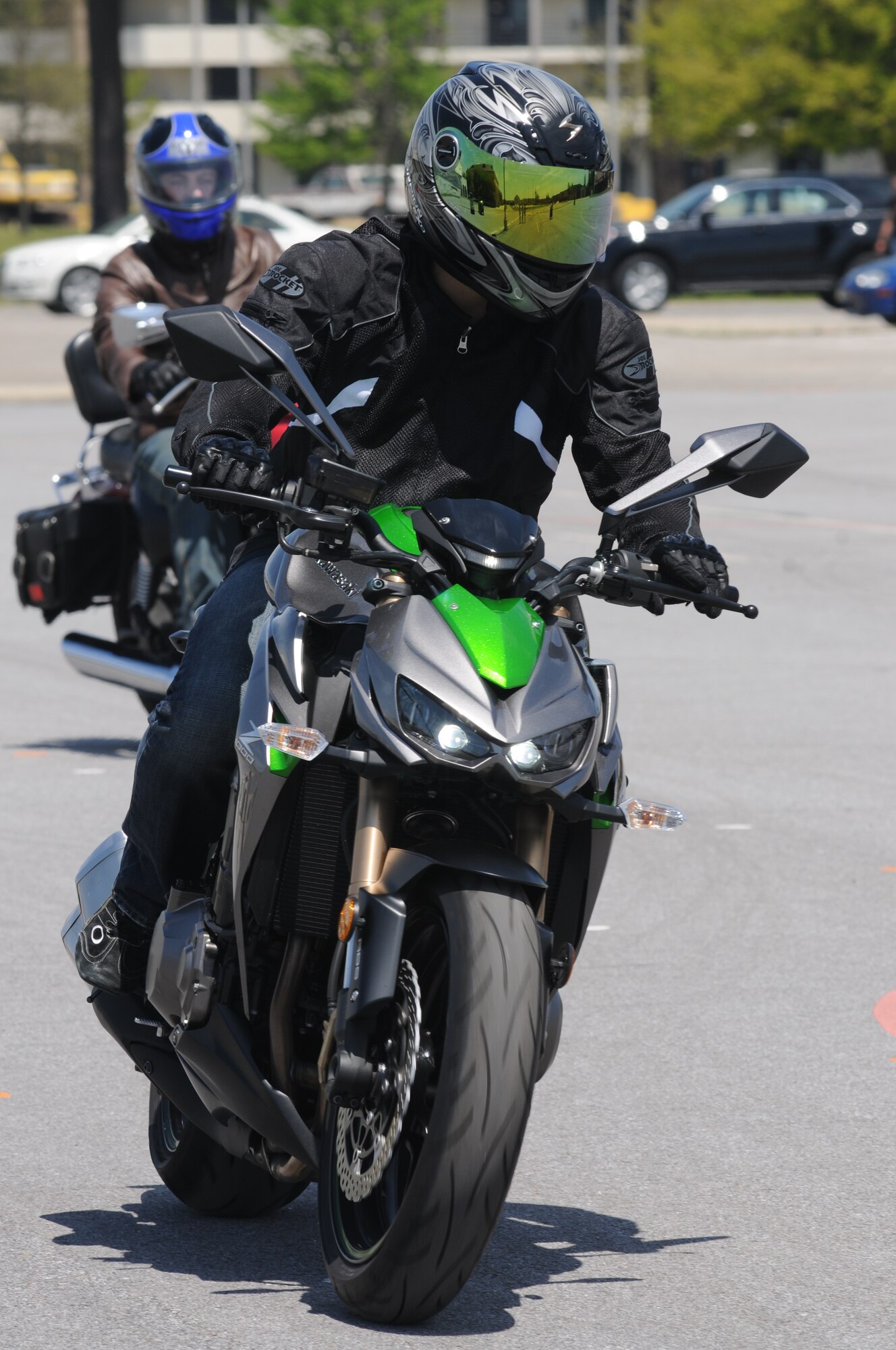 Staff Sgt. James Matthews, 81st Security Forces Squadron, and Senior Airman Blake Pittman, 81st Contracting Squadron, navigate the motorcycle safety course April 11, 2014, at Keesler Air Force Base, Miss.  The course is offered twice a month and teaches students the basic operating skills and safety rules for riding a motorcycle.  (U.S. Air Force photo by Kemberly Groue)