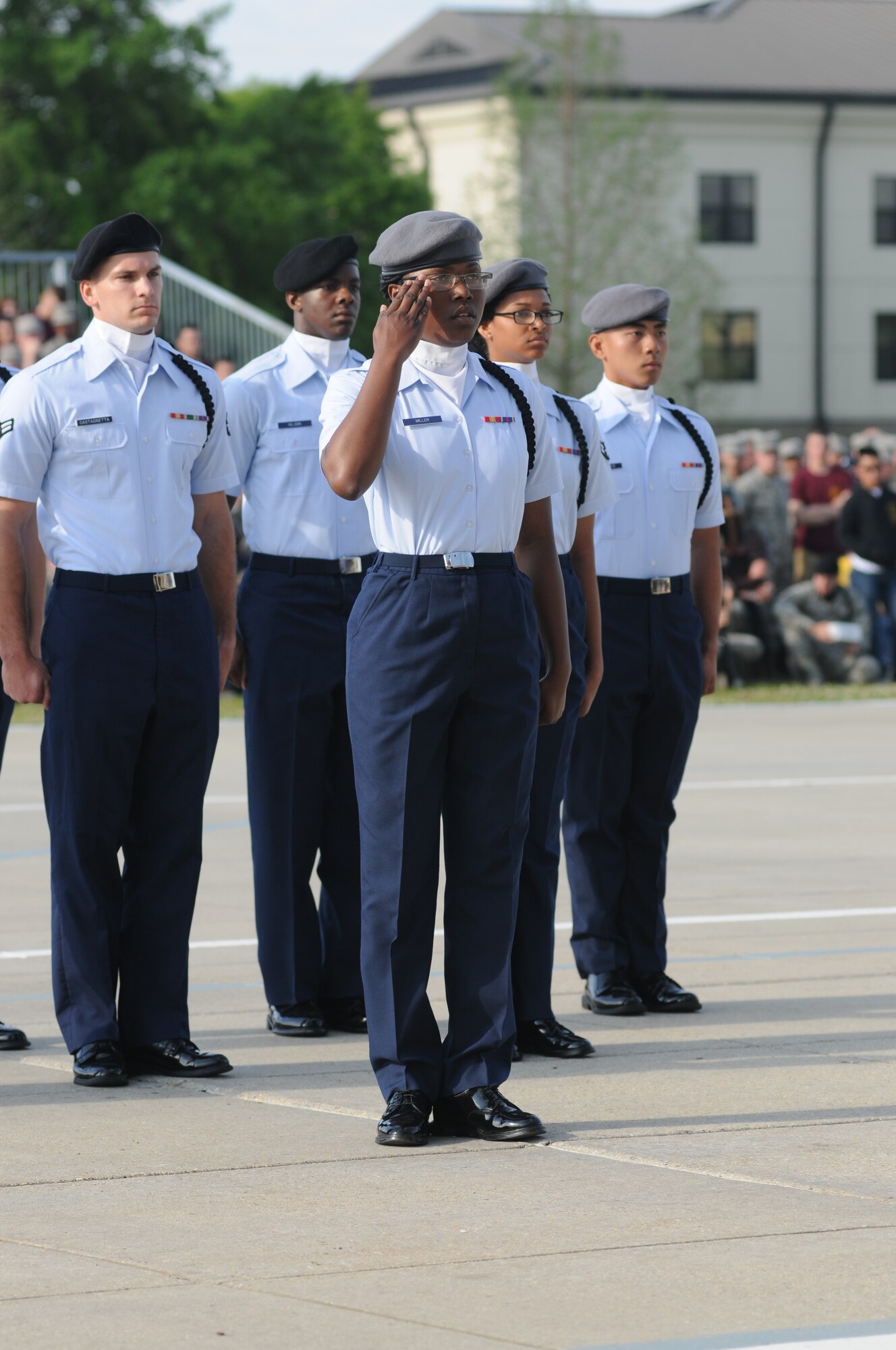 Members of the 335th Training Squadron regulation drill team perform during the 81st Training Group’s drill down competition April 11, 2014, behind the Levitow Training Support Facility, Keesler Air Force Base, Miss.  The 335th TRS placed 1st in regulation and 2nd in open ranks and freestyle.  (U.S. Air Force photo by Kemberly Groue)