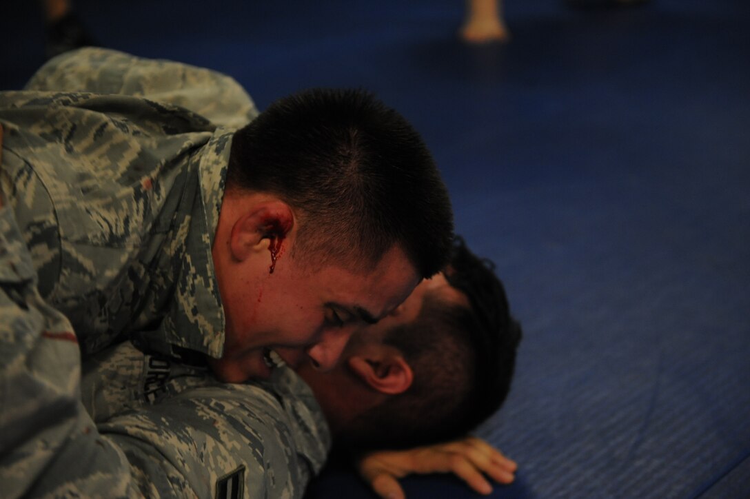 There will be blood. Airman Joshua Camacho takes down an opponent – and gets a little messy in the process – during the Basic Combative Course training at the Western Army National Guard Aviation Training Site gym in Marana, Ariz., March 21. The security forces specialist was a part of an intense 5-day, Army National Guard-instructed event involving unarmed, combative training.