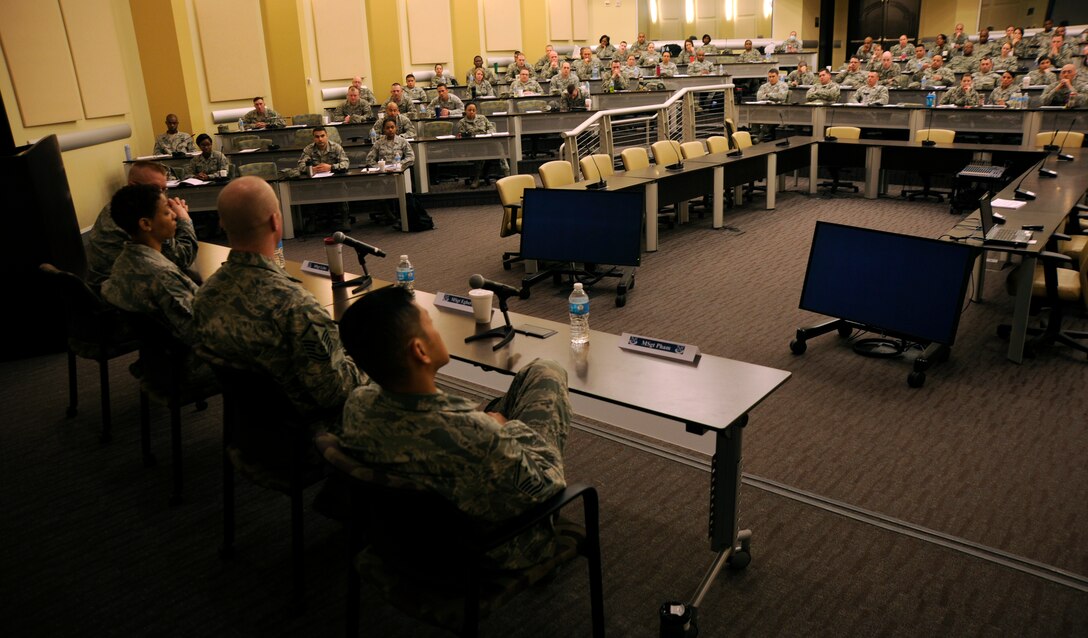 First sergeants from the National Capital Region talk with more than 120 non-commissioned officers from around the area during the Ultimate First Sgt. Experience, April 9, 2014, at Joint Base Andrews, Md. The seminar provided a brief look at the duties and responsibilities of first sergeants and took place from April 7-10. (U.S. Air Force photo/Tech. Sgt. Brian Ferguson)