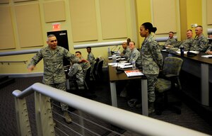 Chief Master Sgt. Jose LugoSantiago gives the opening remarks to more than 120 non-commissioned officers from around the National Capital Region during the Ultimate First Sgt. Experience, April 7, 2014, at Joint Base Andrews, Md. LugoSantiago is the command chief for the Air Force District of Washington. (U.S. Air Force photo/Tech. Sgt. Brian Ferguson)