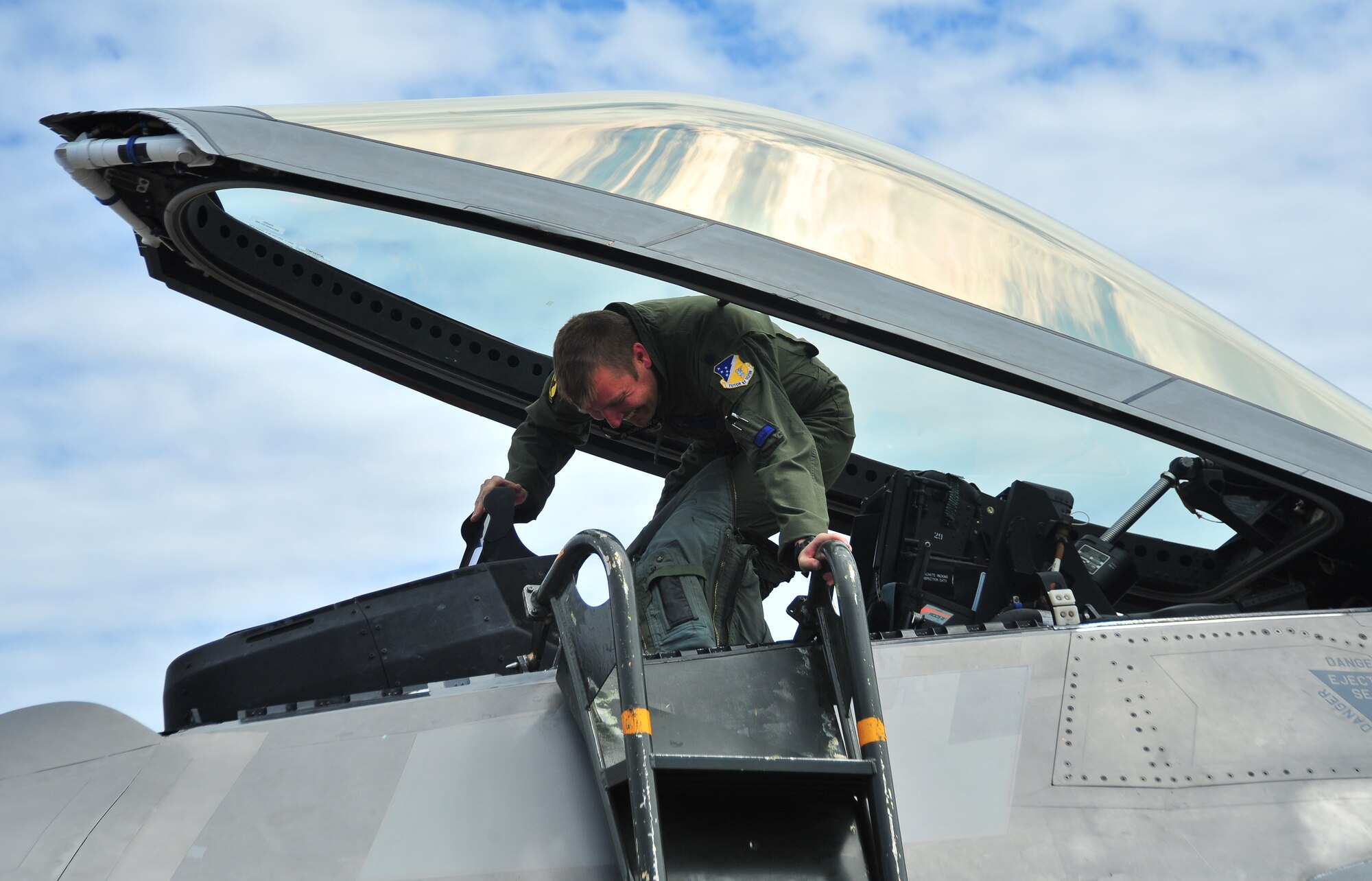 Lt. Col Shawn Anger, 7th Fighter Squadron commander and pilot from Holloman Air Force Base, N.M., gets out of a F-22 Raptor April 8 at the Tyndall flight line. The Raptor was the last of 22 that flew from Holloman to the 95th Fighter Squadron here.  (U.S. Air Force photo by Airman 1st Class Sergio A. Gamboa)