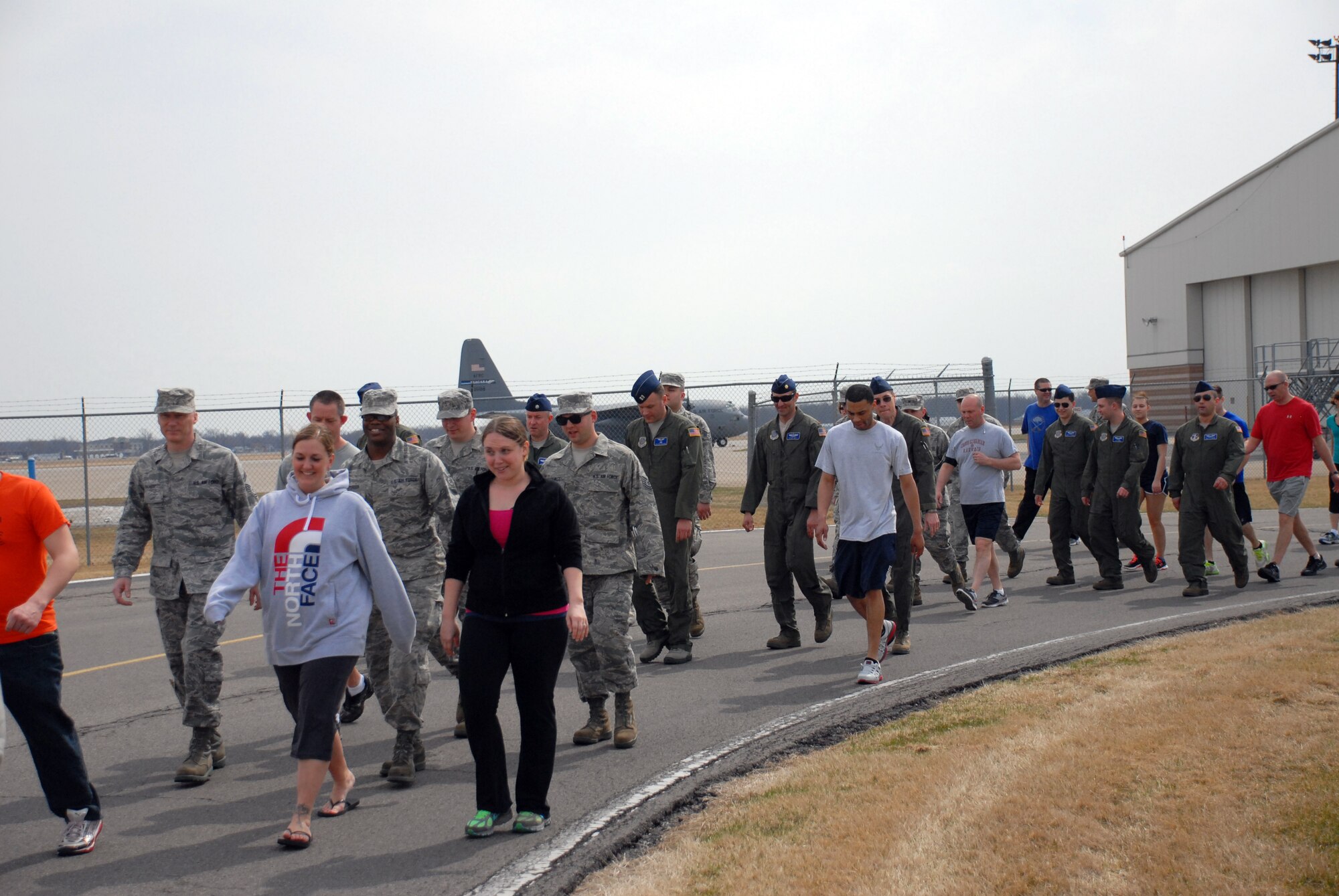 Members of the 107th Airlift Wing participate in the “Walk A Mile” Sexual Assault Awareness Walk held here April 13, 2014. (U.S. Air National Guard photo/Senior Airman Daniel Fravel)