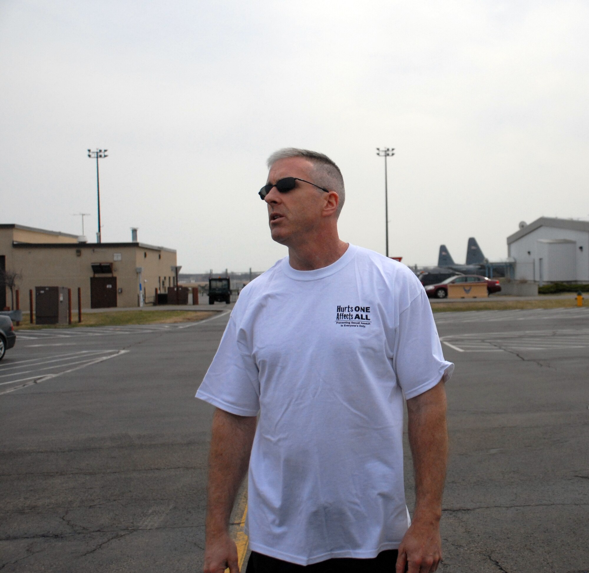 Col. Robert Kilgore addresses members of the 107th Airlift Wing at the start of the “Walk A Mile” Sexual Assault Awareness walk held here Sunday. The event is one of several marking the 107th AW’s observance of April being Sexual Assault Awareness Month. (U.S. Air National Guard photo/Senior Airman Daniel Fravel)