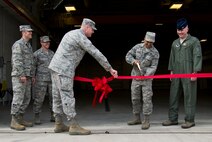 A ribbon cutting ceremony was held at Minot Air Force, N.D., April 10, 2014 for the new Munitions B-52H Stratofortress, three bay conventional munitions facility. The new facility is a 64 personnel work center supporting the maintenance actions on 5th Bomb Wings conventional munitions stockpile. (U.S. Air Force photo/Senior Airman Brittany Y. Auld) 
