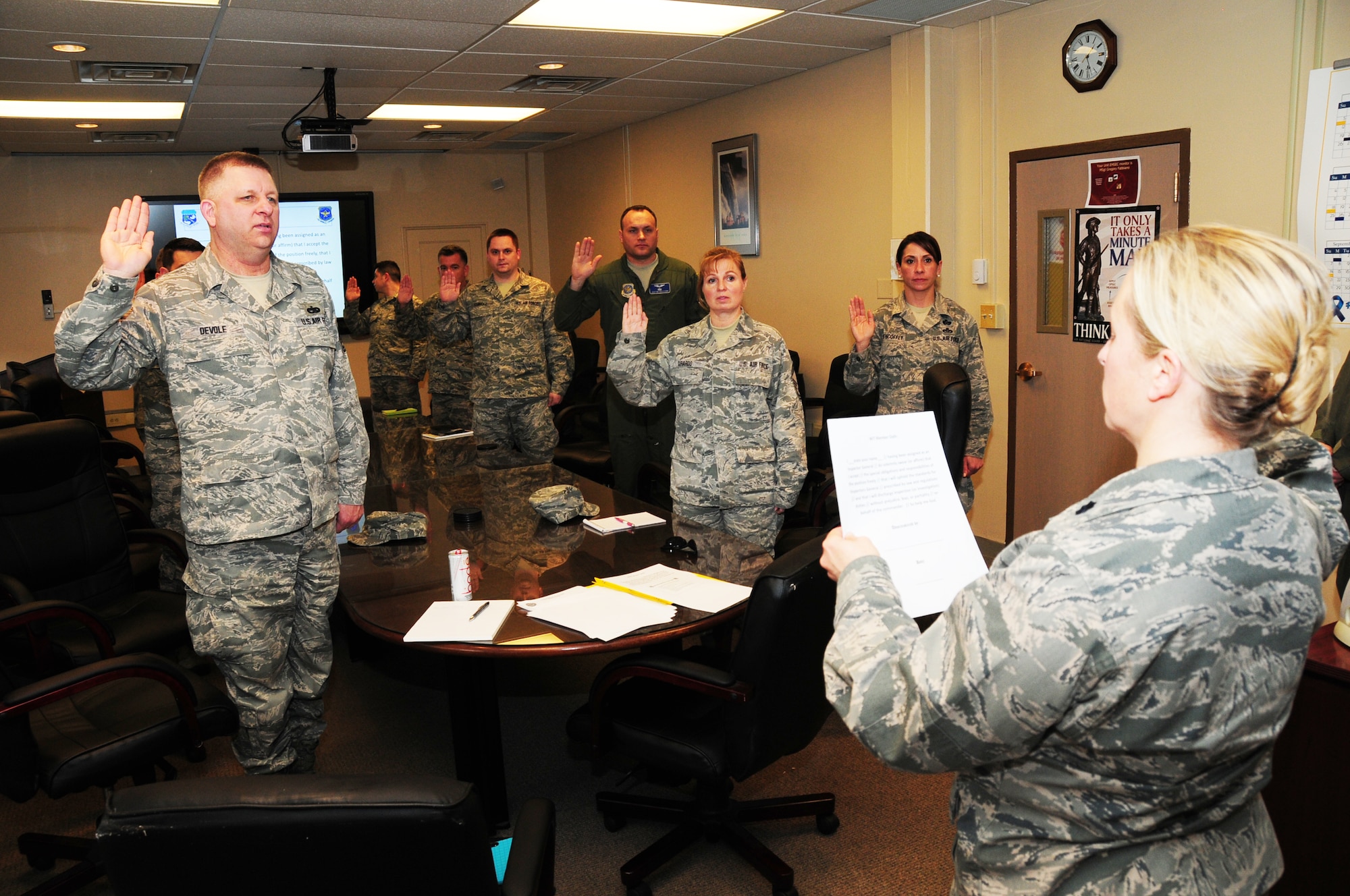 Lt. Col. Jennifer Post, 107th Inspector General, swears in members of the 107th Airlift Wing as the new Wing Inspection Team at the Niagara Falls Reserve Station on April 13, 2014. (U.S. Air National Guard Photo/Senior Master Sgt. Ray Lloyd)