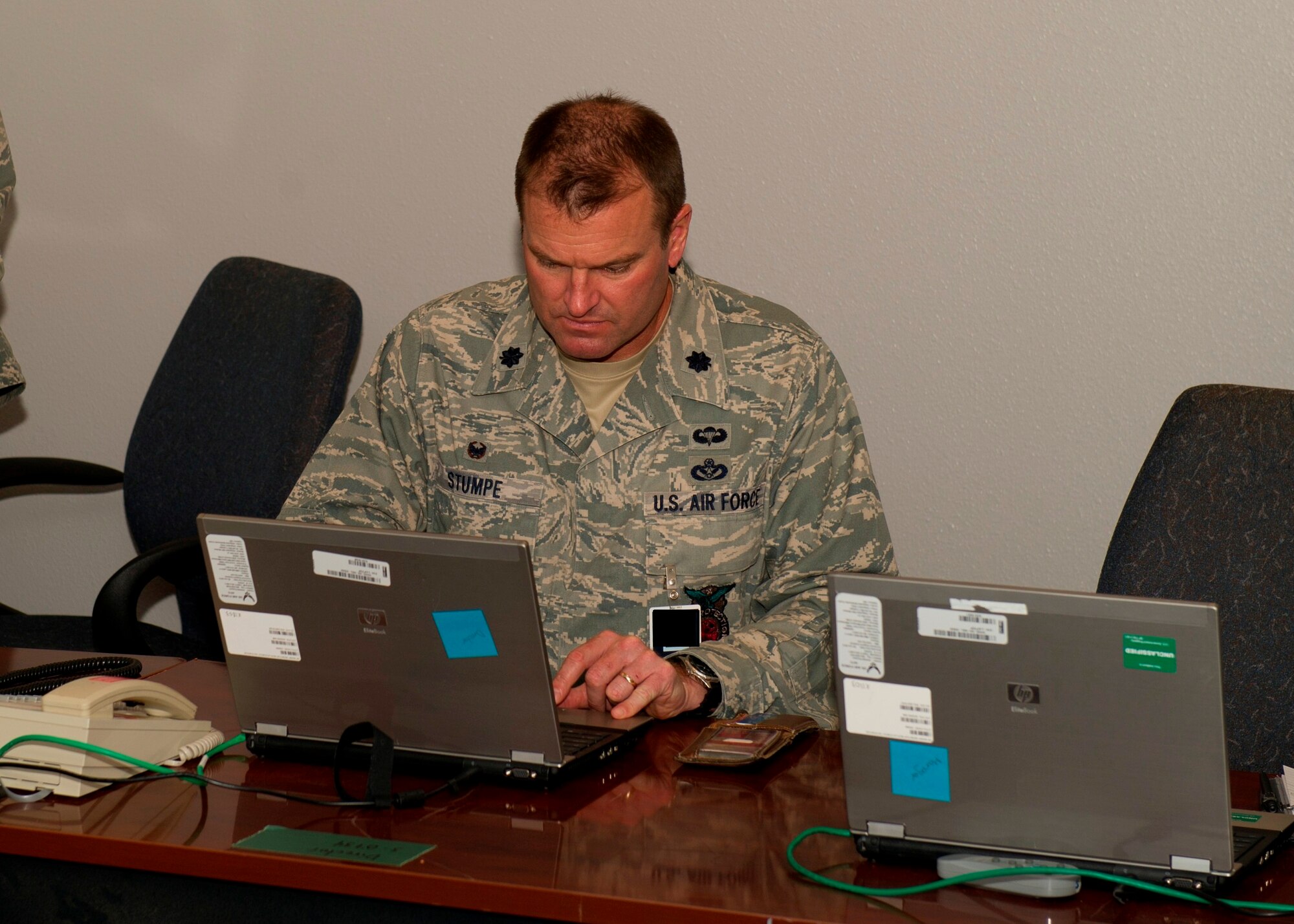 Lt. Col. Brian Stumpe, 325th Civil Engineer Squadron commander and Emergency Operations Center director, logs onto his computer station at the newly renovated EOC April 11. Once all EOC members complete successful network logons at their new stations, the EOC will move from its alternate location and join the Crisis Action Team at the Tyndall Command Center. (U.S. Air Force photo by Senior Airman Christopher Reel) 