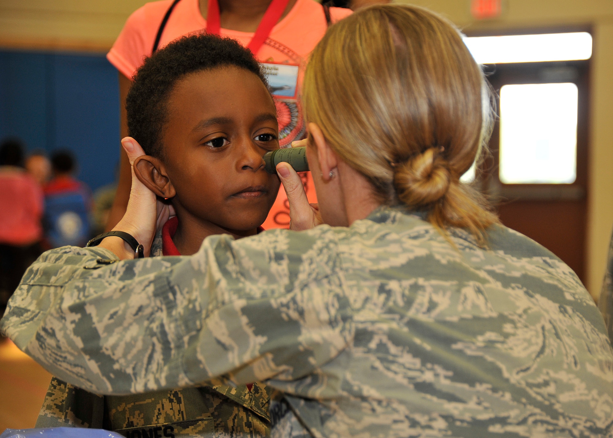 A Jr. Raptor gets face-paint to set him up for a mock deployment April 12 at Tyndall’s Hangar 5. More than 100 military children attended the Jr. Raptor event where military children went through a mock deployment. (U.S. Air Force photo by Airman 1st Class Solomon Cook)