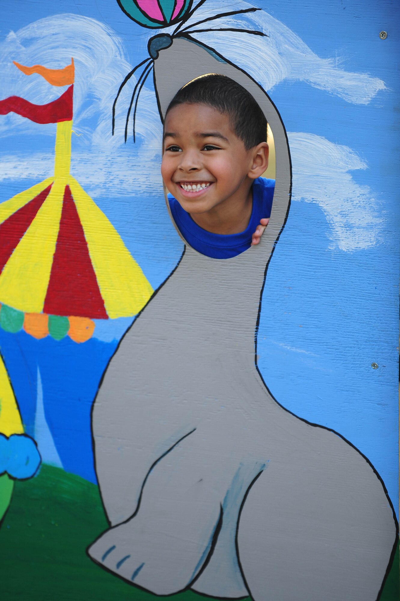 The son of Staff Sgt. Briana Johnson, 4th Force Support Squadron personnel specialist, poses as a seal during the Month of the Military Child event, April 14, at Seymour Johnson Air Force Base, N.C. The Month of the Military Child recognizes the contributions military children make as their parent(s) serve in the armed forces. (U.S. Air Force photo/Senior Airman John Nieves Camacho)