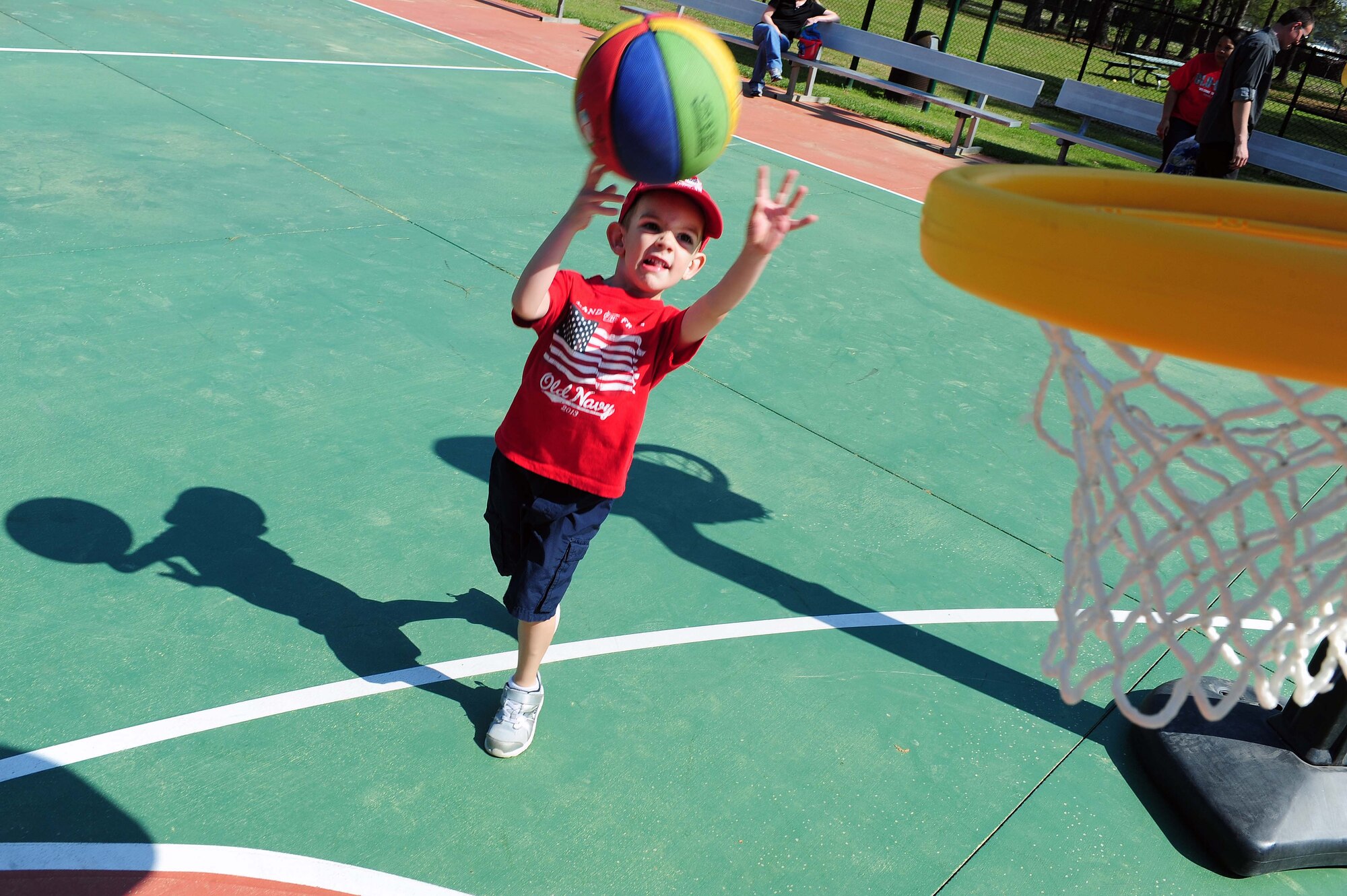 The son of Senior Master Sgt. Michael Jenks, 4th Aircraft Maintenance Squadron assistant superintendent, plays basketball during the Military Child Celebration Block Party, April 14, at Seymour Johnson Air Force Base, N.C. This year’s event featured numerous entertainment outlets, including an Easter egg hunt, a petting zoo, live entertainment, bouncy castles and multiple games and sports. (U.S. Air Force photo/Senior Airman John Nieves Camacho)