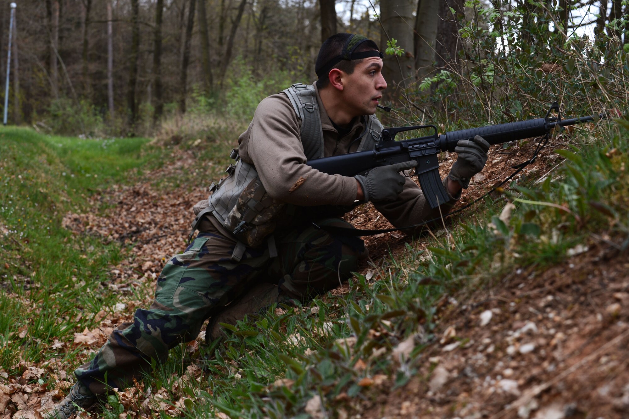 U.S. Air Force Senior Airman Isaac Martinez-Trevino, 606th Air Control Squadron command and control battle field management from Santa Maria, Calif., scouts out targets during a combat readiness training course at Spangdahlem Air Base, Germany, April 15, 2014. The 606th ACS has 21 different career fields that provide support for a self-contained unit. (U.S. Air Force photo by Airman 1st Class Kyle Gese/Released)