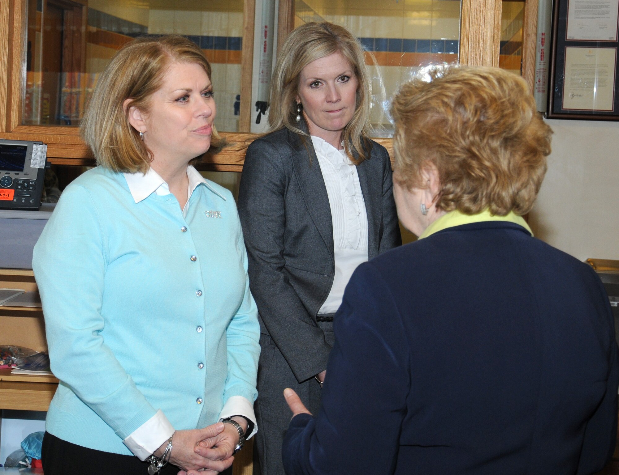 Sharon Gorenc, left, wife of U.S. Air Force Gen. Frank Gorenc, U.S. Air Forces in Europe and Air Forces Africa commander, and Shannon Bibb, center, wife of U.S. Air Force Col. Kenneth T. Bibb Jr., 100th Air Refueling Wing commander, listen to Joan Goode, RAF Mildenhall Youth Center director of youth programs, April 14, 2014, during a visit to RAF Mildenhall, England. Sharon Gorenc visited various organizations on base to get a better understanding of the services the base provides to families. (U.S. Air Force photo by Gina Randall/Released)  