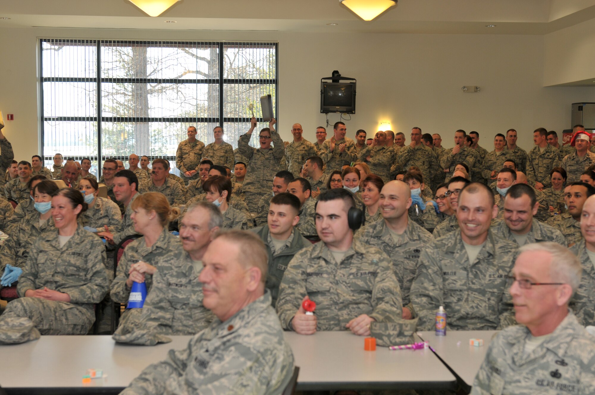 STRATTON AIR NATIONAL GUARD BASE, N.Y. -- 109th Airlift Wing Airmen from all different sections on base cheer on their peers during a promotion recogntion ceremony for E-3s through E-6s on April 6, 2014. Chief Master Sgt. Amy Giaquinto, 109th Airlift Wing command chief, said she hopes the promotion recognition ceremonies will boost morale and promote wing cohesiveness. (Air National Guard photo by Staff Sgt. Benjamin German/Released)