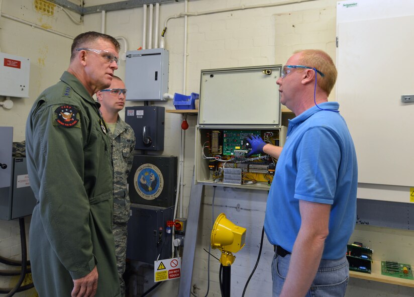 Martin Parker, right, 100th Civil Engineer Squadron Airfield Lighting supervisor from Newmarket, England, speaks to U.S. Air Force Gen. Frank Gorenc, U.S. Air Forces in Europe and Air Forces Africa commander, during a tour of Airfield Lighting April 14, 2014, on RAF Mildenhall, England. Gorenc said the hard work and dedication of the 100th CES impressed him. (U.S. Air Force photo by Airman 1st Class Kyla Gifford/Released)