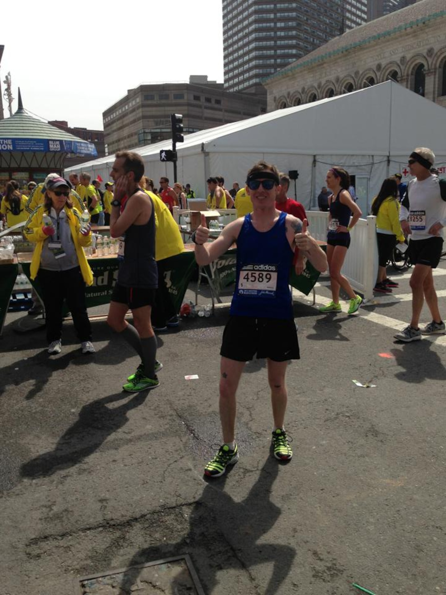 TSgt. Blaine Truman, 43rd Aircraft Maintenance Unit F22 flightline expeditor, gives two thumbs up after completing the Boston Marathon in 2013. He finished the race twenty minutes before the bombs were detonated. (U.S. Air Force courtesy photo)