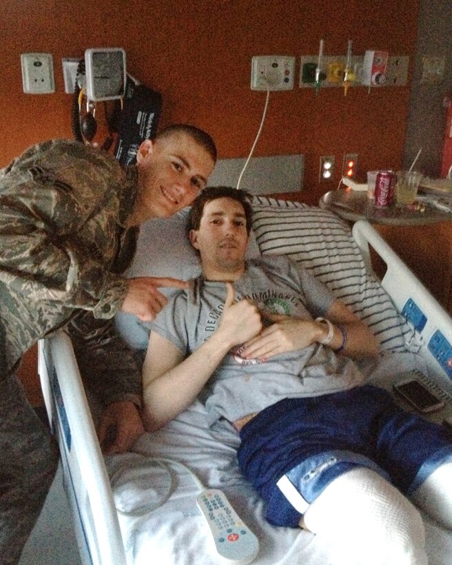 Air Force Airman 1st Class Alan Bauman visits his brother, Jeff Bauman, in a Boston hospital. Jeff lost both of his legs from the explosion near the finish line at the Boston Marathon on April 15, 2013. Courtesy photo