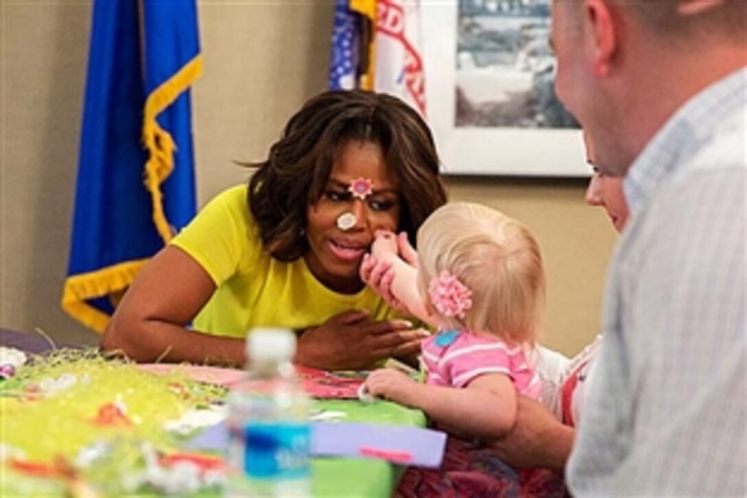 First Lady Michelle Obama visits with families working on crafts at Maryland Fisher House IV at Walter Reed National Military Medical Center in Bethesda, Md., April 14, 2014. 