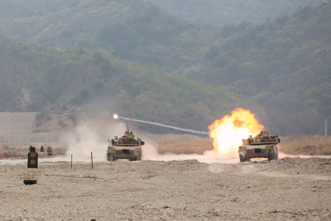 M1A1 Abrams Tanks with Company C., 4th Tank Battalion, Marine Corps Forces Reserve, fire 120mm rounds at targets during a combined arms, live-fire exercise (CALFEX) as part of Exercise Ssang Yong 2014 (SY14) here, April 4. The CALFEX incorporated all aspects of a Marine Air-Ground Task Force, sending a company of Marines into assault with direct fire support from AH-1W Super Cobra and UH-1Y Huey helicopters, AAV’s, Light Armored Vehicle-25’s and M777A1 Lightweight Howitzers. SY14 is conducted annually in the Republic of Korea to enhance interoperability between U.S. and ROK forces by performing a full spectrum of amphibious operations, while showcasing sea-based power projection in the Asia-Pacific. (Official U.S. Marine Corps photo by Lance Cpl. Andrew Kuppers) 