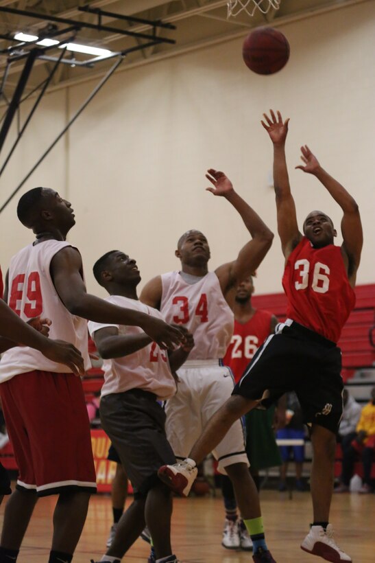 Stephen Reid, a guard for the Quantico National League All-Star team takes a shot during the 2014 Quantico Intramural All-Star Basketball Game at Barber Physical Activity Center on April 7, 2014. The National League team won the game 51-42. 