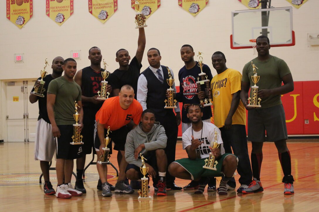 The Quantico National League All-Star Intramural Basketball Team pose with their trophies for after winning the 2014 Quantico Intramural All-Star Basketball Game at Barber Physical Activity Center on April 7, 2014. The National League won the game 51-42. 