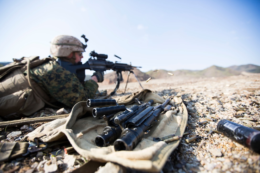 Lance Cpl. Tyler E. Hunter, an automatic rifleman with Company E., Battalion Landing Team 2nd Battalion, 5th Marines, Regimental Landing Team 31, 3d Marine Expeditionary Brigade, and a native of West Chicago, Ill., provides suppressing fire during a combined arms, live-fire exercise (CALFEX) as part of Exercise Ssang Yong 2014 (SY14) here, April 4. The CALFEX incorporated all aspects of a Marine Air-Ground Task Force, sending a company of Marines into assault with direct fire support from AH-1W Super Cobra and UH-1Y Huey helicopters, AAV’s, Light Armored Vehicle-25’s and M777A1 Lightweight Howitzers. SY14 is conducted annually in the Republic of Korea to enhance interoperability between U.S. and ROK forces by performing a full spectrum of amphibious operations, while showcasing sea-based power projection in the Asia-Pacific. (Official U.S. Marine Corps photo by Lance Cpl. Andrew Kuppers) 