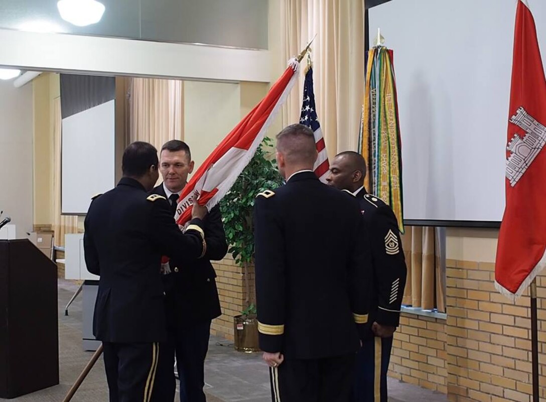 Chief of Engineers LTG Thomas Bostick passes the colors to the incoming commander of the South Atlantic Division, Colonel Donald L. Walker, at the South Atlantic Division Change of Command on April 14. Also shown are BG Donald E. Jackson, outgoing SAD commander, and SAD Command Sergeant Major Antonio Jones.